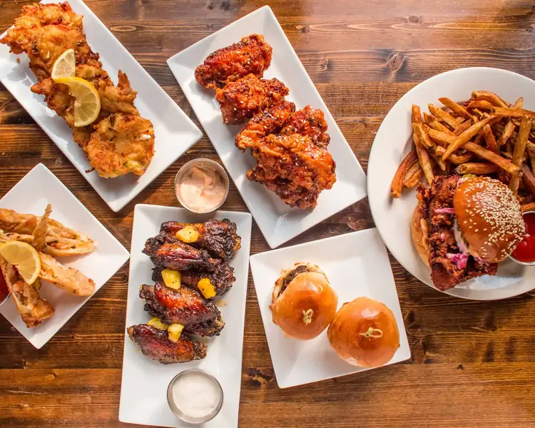Expedition Cafe signature dishes Loaded Bacon Cheese Fries
Excursion Wings
Chicken Tenders